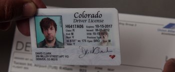 Movie still from “We're the Millers” (2013), directed by Rawson Marshall Thurber – A driver's license with a picture of a man's face on it; Extreme Close Up shot, High angle
