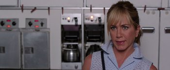 Movie still from “We're the Millers” (2013), directed by Rawson Marshall Thurber – A woman standing in front of two ovens in a kitchen; Close Up shot, Over the shoulder angle