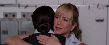 Movie still from “We're the Millers” (2013), directed by Rawson Marshall Thurber – A woman hugging another woman with a ring on her finger; Close Up shot, Over the shoulder angle