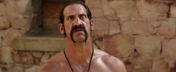 Movie still from “We're the Millers” (2013), directed by Rawson Marshall Thurber – A man with a beard and a mustache is looking at the camera; Close Up shot, Over the shoulder angle