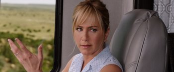 Movie still from “We're the Millers” (2013), directed by Rawson Marshall Thurber – A person sitting in a vehicle; Close Up shot, Over the shoulder angle