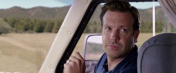 Movie still from “We're the Millers” (2013), directed by Rawson Marshall Thurber – A person sitting in a car; Close Up shot, Over the shoulder angle