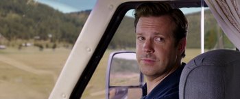 Movie still from “We're the Millers” (2013), directed by Rawson Marshall Thurber – A person sitting in a helicopter window; Close Up shot, Over the shoulder angle