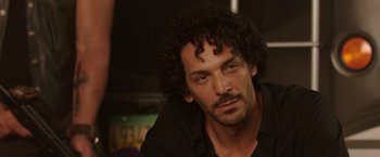 Movie still from “We're the Millers” (2013), directed by Rawson Marshall Thurber – A person wearing a black shirt; Close Up shot, Over the shoulder angle