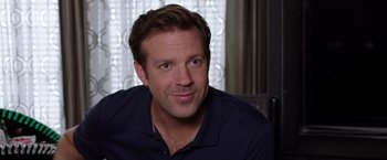 Movie still from “We're the Millers” (2013), directed by Rawson Marshall Thurber – A person sitting in a room; Close Up shot, Over the shoulder angle