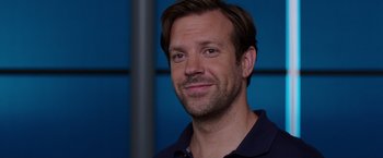 Movie still from “We're the Millers” (2013), directed by Rawson Marshall Thurber – A person smiling for the camera; Close Up shot, Over the shoulder angle