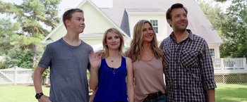 Movie still from “We're the Millers” (2013), directed by Rawson Marshall Thurber – A group of people standing next to each other in front of a house; Medium shot, Over the shoulder angle