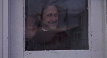 Movie still from “Lars and the Real Girl” (2007), directed by Craig Gillespie – A man looking out of a window at night; Close Up shot, Over the shoulder angle