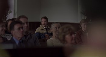 Movie still from “Lars and the Real Girl” (2007), directed by Craig Gillespie – A group of people sitting in a room; Medium shot, Over the shoulder angle