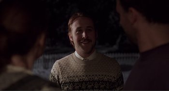 Movie still from “Lars and the Real Girl” (2007), directed by Craig Gillespie – A man with a beard and mustache wearing a sweater; Medium shot, Over the shoulder angle