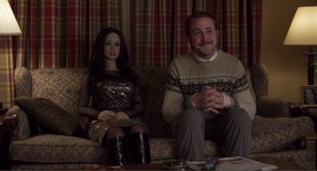 Movie still from “Lars and the Real Girl” (2007), directed by Craig Gillespie – A man sitting next to a woman on a couch; Medium shot, Over the shoulder angle