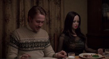 Movie still from “Lars and the Real Girl” (2007), directed by Craig Gillespie – A man and a woman sitting at a dinner table; Medium shot, Over the shoulder angle