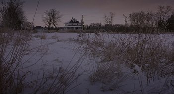 Movie still from “Lars and the Real Girl” (2007), directed by Craig Gillespie – A house in the middle of a field covered in snow; Extreme Wide shot, Low angle