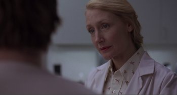 Movie still from “Lars and the Real Girl” (2007), directed by Craig Gillespie – A woman wearing a white lab coat looking at a man; Close Up shot, Over the shoulder angle