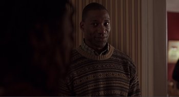 Movie still from “Lars and the Real Girl” (2007), directed by Craig Gillespie – A man wearing a sweater standing in front of a mirror; Close Up shot, Over the shoulder angle