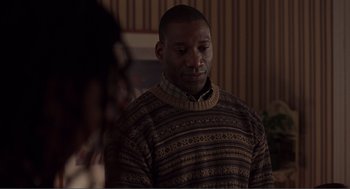 Movie still from “Lars and the Real Girl” (2007), directed by Craig Gillespie – A man wearing a sweater standing in front of a mirror; Close Up shot, Over the shoulder angle