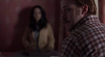 Movie still from “Lars and the Real Girl” (2007), directed by Craig Gillespie – A man and a woman are sitting in front of a table; Medium shot, Over the shoulder angle