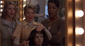 Movie still from “Lars and the Real Girl” (2007), directed by Craig Gillespie – Two women standing next to each other in front of a mannequin; Close Up shot, Over the shoulder angle