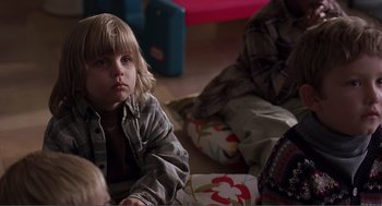 Movie still from “Lars and the Real Girl” (2007), directed by Craig Gillespie – A little boy sitting on the floor next to a woman; Close Up shot, Over the shoulder angle