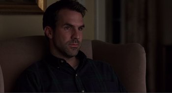 Movie still from “Lars and the Real Girl” (2007), directed by Craig Gillespie – A person sitting on a couch; Close Up shot, High angle