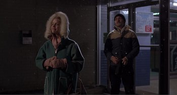 Movie still from “Lars and the Real Girl” (2007), directed by Craig Gillespie – A woman in a green jacket and a man in a blue jacket; Medium shot, Low angle