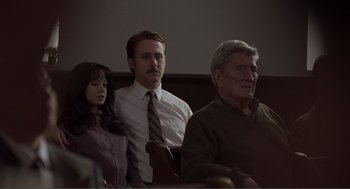 Movie still from “Lars and the Real Girl” (2007), directed by Craig Gillespie – Two men and a woman sitting in front of each other; Medium shot, Over the shoulder angle