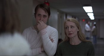 Movie still from “Lars and the Real Girl” (2007), directed by Craig Gillespie – A man and a woman standing next to each other in a room; Close Up shot, Over the shoulder angle