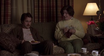 Movie still from “Lars and the Real Girl” (2007), directed by Craig Gillespie – A man and a woman sitting on a couch; Medium shot, Over the shoulder angle