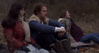 Movie still from “Lars and the Real Girl” (2007), directed by Craig Gillespie – A man sitting next to two other people; Medium shot, Over the shoulder angle