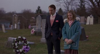 Movie still from “Lars and the Real Girl” (2007), directed by Craig Gillespie – A man and a woman standing in front of a grave; Medium shot, Over the shoulder angle