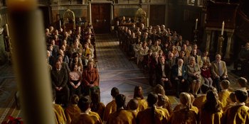 Movie still from “Last Christmas” (2019), directed by Paul Feig – A group of people sitting in a room; Wide shot, High angle