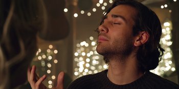 Movie still from “Last Christmas” (2019), directed by Paul Feig – A person with his eyes closed; Close Up shot, Low angle