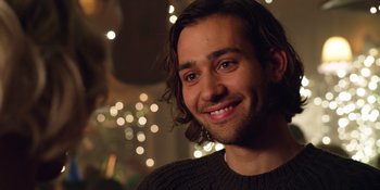 Movie still from “Last Christmas” (2019), directed by Paul Feig – A person wearing a sweater; Close Up shot, Over the shoulder angle
