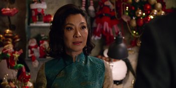 Movie still from “Last Christmas” (2019), directed by Paul Feig – A person wearing a dress and looking at the camera; Close Up shot, Over the shoulder angle