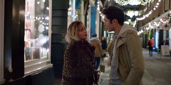 Movie still from “Last Christmas” (2019), directed by Paul Feig – A man and a woman talking on the sidewalk; Medium shot, Over the shoulder angle