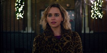 Movie still from “Last Christmas” (2019), directed by Paul Feig – A person wearing a leopard print coat; Close Up shot, Over the shoulder angle