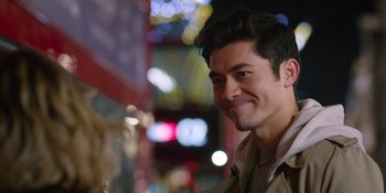 Movie still from “Last Christmas” (2019), directed by Paul Feig – A person smiling at the camera; Close Up shot, Over the shoulder angle