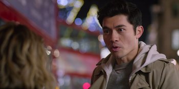 Movie still from “Last Christmas” (2019), directed by Paul Feig – A person wearing a jacket; Close Up shot, Over the shoulder angle