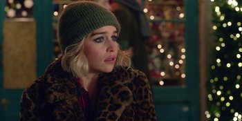 Movie still from “Last Christmas” (2019), directed by Paul Feig – A person wearing a jacket and a hat; Close Up shot, Over the shoulder angle