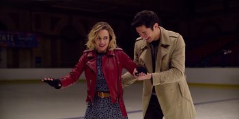 Movie still from “Last Christmas” (2019), directed by Paul Feig – A man and a woman are holding hands and smiling; Medium shot, High angle