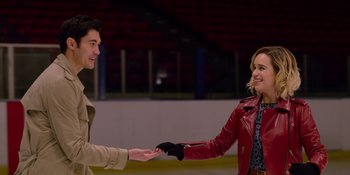 Movie still from “Last Christmas” (2019), directed by Paul Feig – A man and a woman shaking hands on a ice rink; Medium shot, Over the shoulder angle