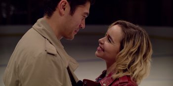 Movie still from “Last Christmas” (2019), directed by Paul Feig – A man and a woman smiling at each other; Close Up shot, Over the shoulder angle