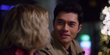 Movie still from “Last Christmas” (2019), directed by Paul Feig – A man in a brown jacket talking to a woman in a brown jacket; Close Up shot, Over the shoulder angle