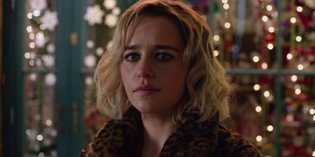 Movie still from “Last Christmas” (2019), directed by Paul Feig – A person wearing a leopard print jacket; Close Up shot, Over the shoulder angle