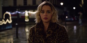 Movie still from “Last Christmas” (2019), directed by Paul Feig – A person wearing a coat; Close Up shot, Over the shoulder angle