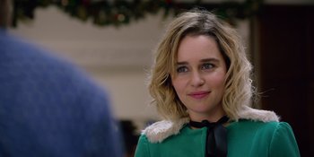 Movie still from “Last Christmas” (2019), directed by Paul Feig – A person wearing a green jacket; Close Up shot, Over the shoulder angle
