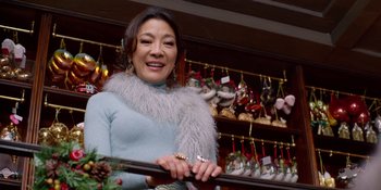 Movie still from “Last Christmas” (2019), directed by Paul Feig – A woman standing in front of christmas decorations; Close Up shot, Low angle