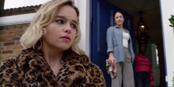 Movie still from “Last Christmas” (2019), directed by Paul Feig – Two women standing next to each other in front of a building; Close Up shot, Over the shoulder angle
