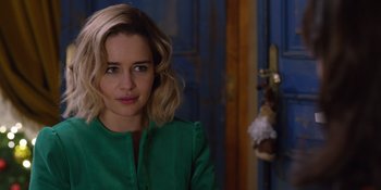 Movie still from “Last Christmas” (2019), directed by Paul Feig – A person wearing a green shirt; Close Up shot, Over the shoulder angle