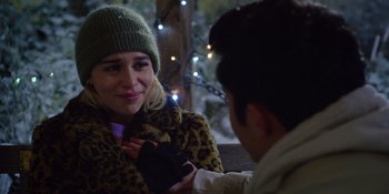 Movie still from “Last Christmas” (2019), directed by Paul Feig – A woman in a leopard print coat and a man in a green hat; Close Up shot, Over the shoulder angle
